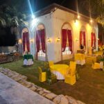 Birthday celebration setup with balloons and floral decor