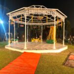 Family dinner celebration in open garden area at Garden of 7 Senses