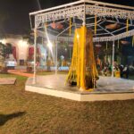 Beautifully lit walkway with candles and plants at Garden of 7 Senses